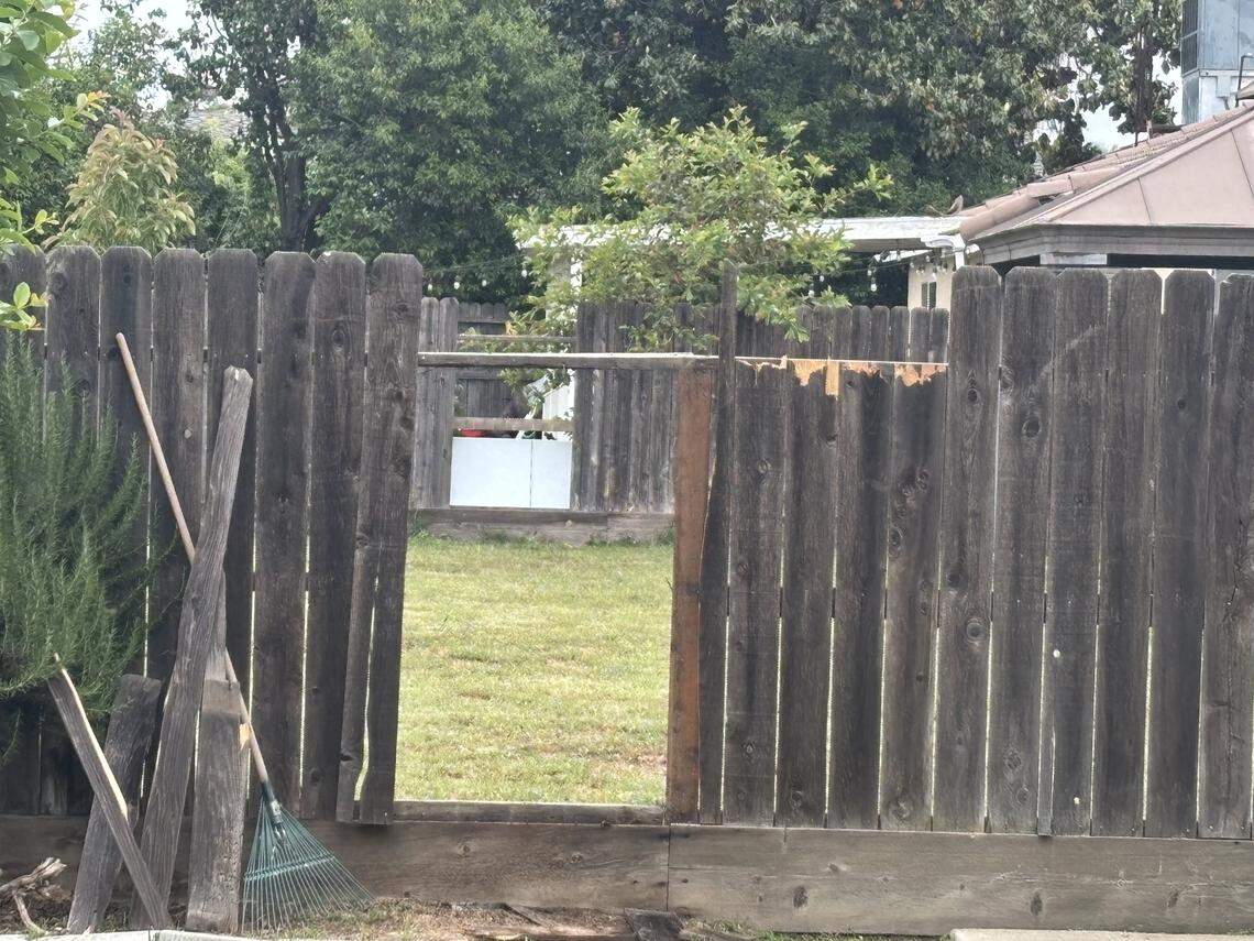 A fence remains broken at the home where Daniela Pedraza cares for a woman on West Brian Avenue in Porterville, California in the aftermath of the fatal shooting of a deputy on April 9.