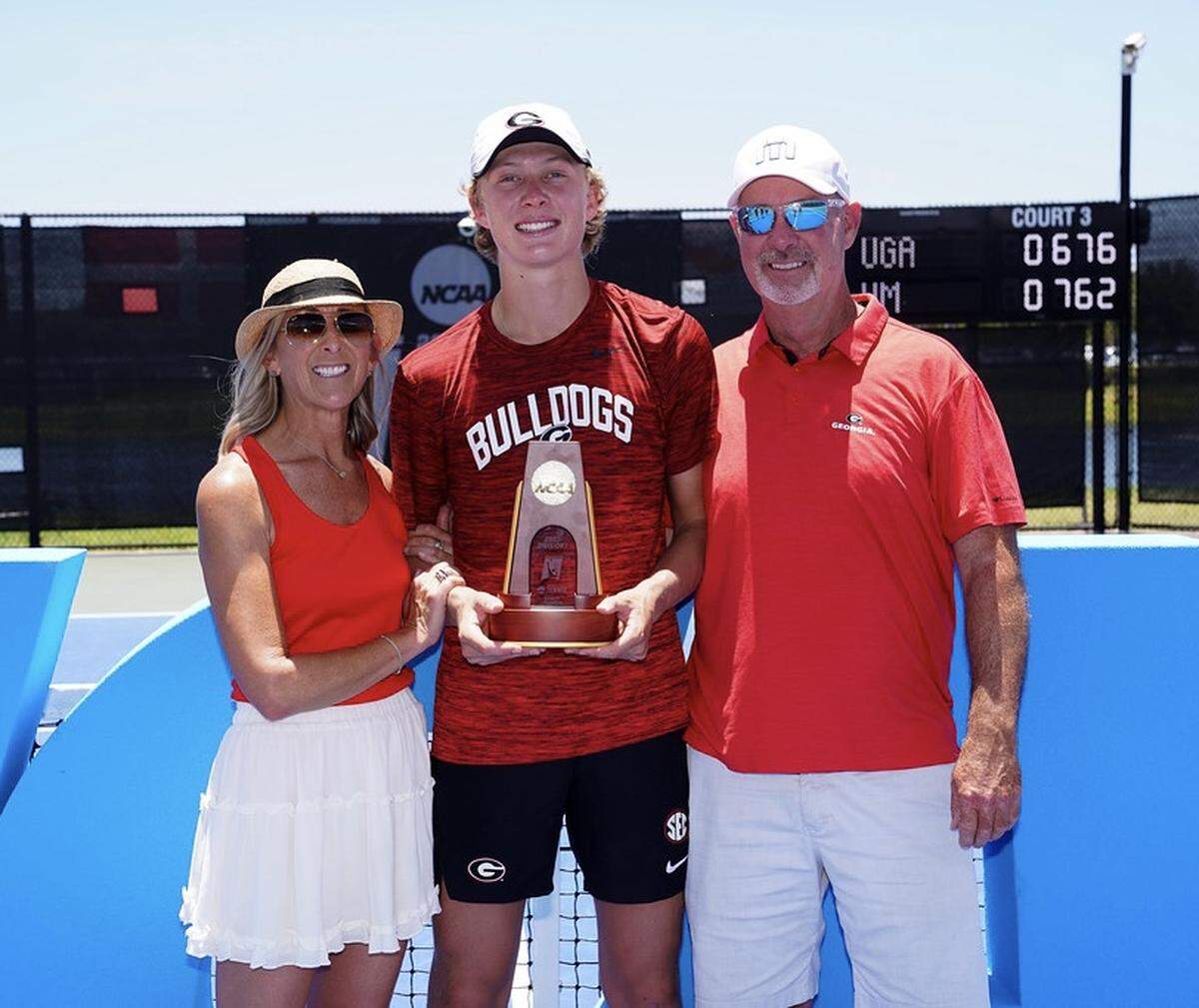 Ethan Quinn of Georgia poses for a photo with the singles champion trophy after winning the 2023 NCAA Division I men’s tennis championships at the USTA National Campus in Orlando, Florida on Saturday, May 27, 2023.