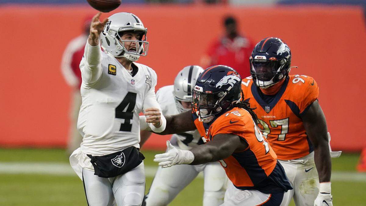 Las Vegas Raiders quarterback Derek Carr throws against the Broncos during the first half Sunday, Jan. 3, 2021, in Denver.