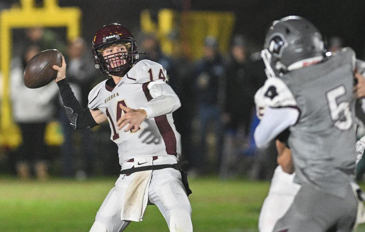 Sierra quarterback Aaron Irvine throws against against Fresno Christian during their eight-man championship game at Fresno Christian on Friday, Nov. 17, 2023.