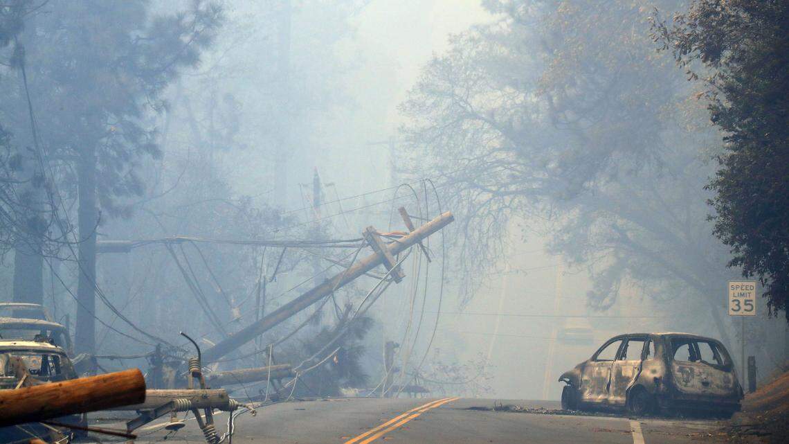 Downed PG&E power lines and abandoned cars after the Camp Fire ravaged the town of Paradise Nov. 10, 2018.