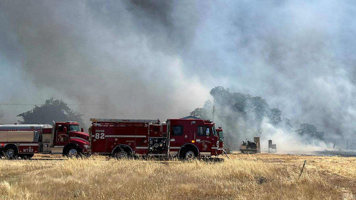 Fresno County firefighters battle a blaze north of Reedley on Thursday afternoon, July 7, 2022.