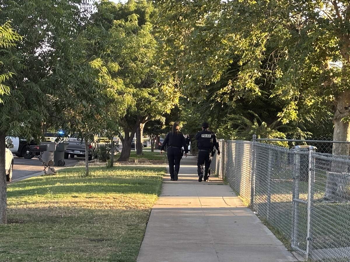 Officers canvass the neighborhood near San Pablo and Beechwood avenues for witnesses and security footage after a reported shooting around 6:30 a.m. Tuesday, July 14, 2026, in Fresno.
