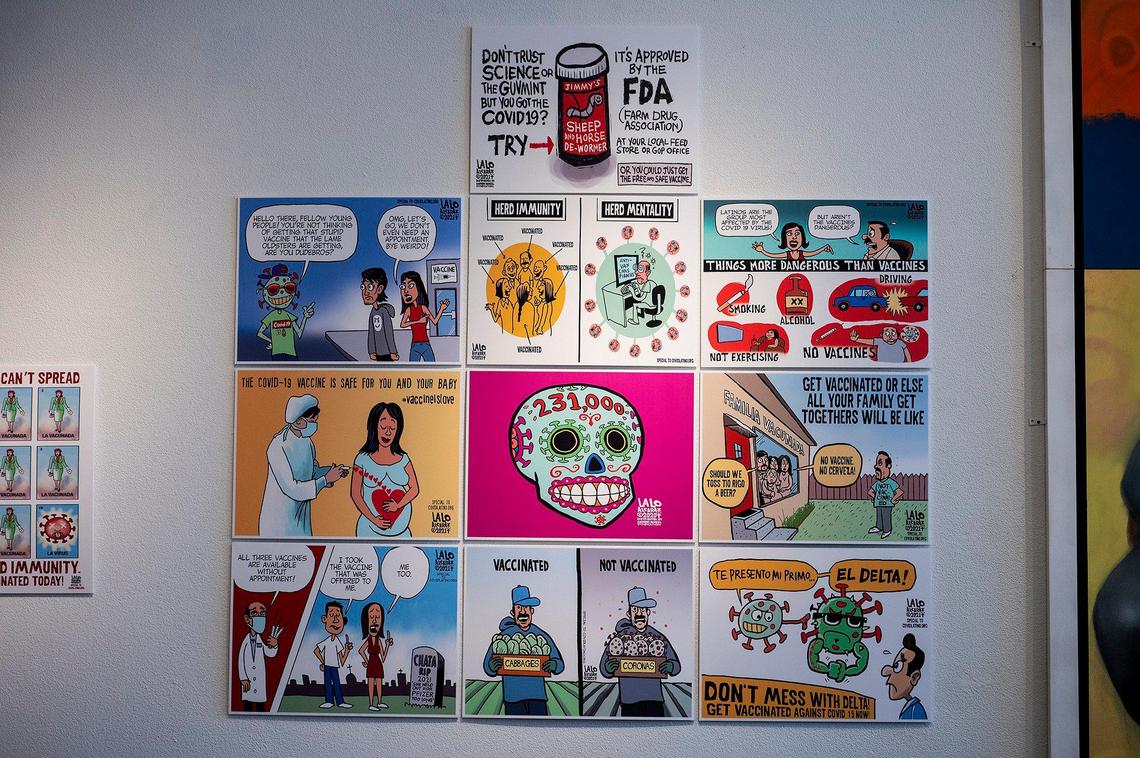 Artwork by political cartoonist Lalo Alcaraz is displayed at the Merced Multicultural Arts Center in downtown Merced, Calif., on Thursday, Oct. 28, 2021. In celebration of Dia de los Muertos, Cultiva La Salud-Merced County will open an art exhibition containing pieces by Alcaraz created for the COVIDLatino.org project.