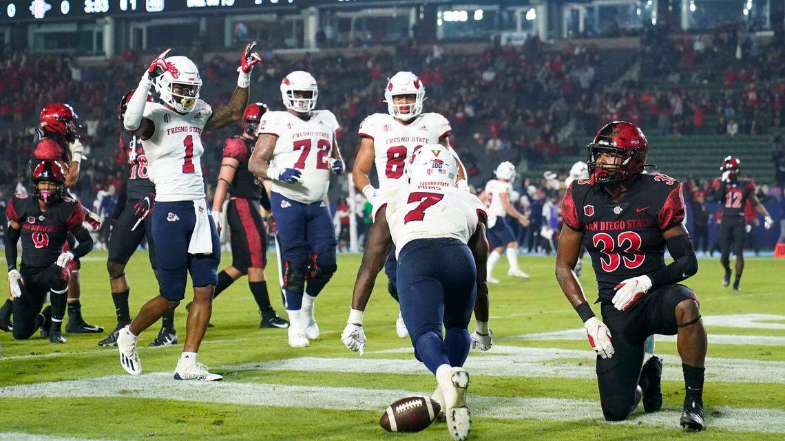 Fresno State running back Jordan Mims (7) celebrates his touchdown with teammates during the first half of an NCAA college football game against San Diego State on Saturday, Oct. 30, 2021, in Carson, Calif. (AP Photo/Jae C. Hong)