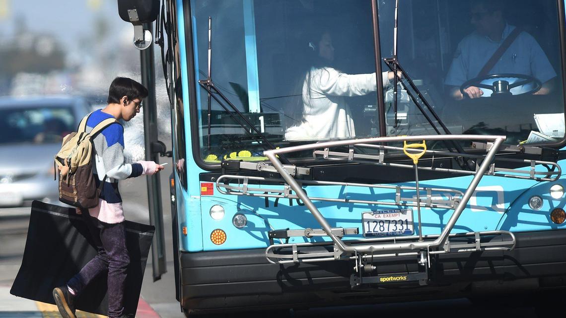 Fresno City College students board a city bus, Thursday Feb. 13, 2020. The State Center Community College District implemented a free bus program for Fresno City College and Clovis Community College students in 2017. As long as students purchased an Associated Student Body card for $5 they can take free bus rides. But the funds for the program ran out and it’s going to be ending in May if the board doesn’t find other ways to fund the program.