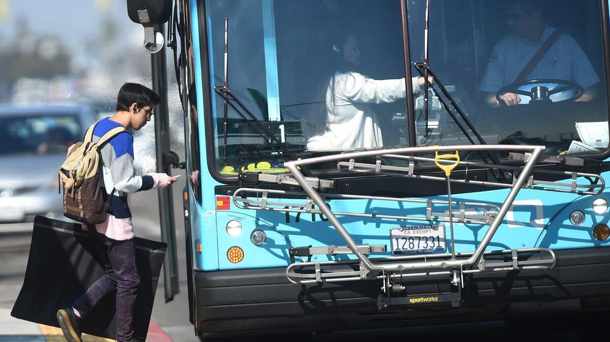 Fresno City College students board a city bus, Thursday Feb. 13, 2020. The State Center Community College District implemented a free bus program for Fresno City College and Clovis Community College students in 2017. As long as students purchased an Associated Student Body card for $5 they can take free bus rides. But the funds for the program ran out and it’s going to be ending in May if the board doesn’t find other ways to fund the program.