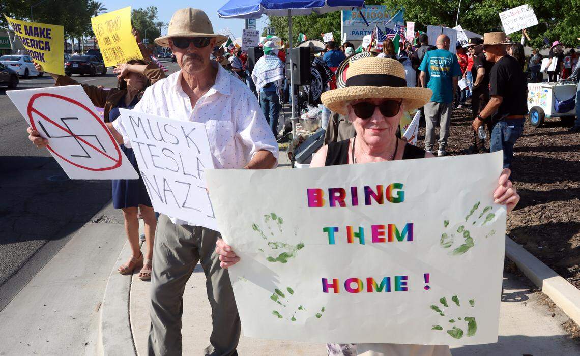 Nancy Schultz, a retired lawyer, takes part in the May Day demonstration against Trump administration policies on Blackstone near Alluvial in Fresno on May 1, 2025.