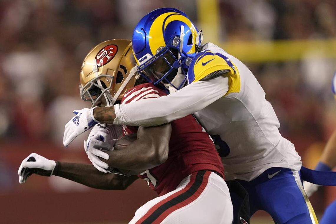 San Francisco 49ers wide receiver Brandon Aiyuk, left, is tackled by Los Angeles Rams cornerback Jalen Ramsey during the first half of an NFL game in Santa Clara, Calif., Monday, Nov. 15, 2021.