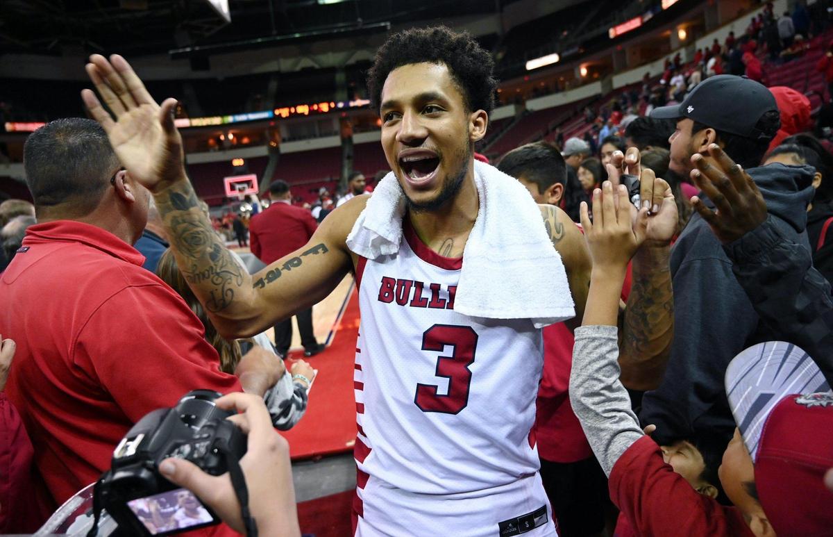 Fresno State point guard Isaiah Hill celebrates with fans after the Bulldogs defeated Southern Utah 67-48 in the semifinals of The Basketball Classic Monday, March 28, 2022 in Fresno.