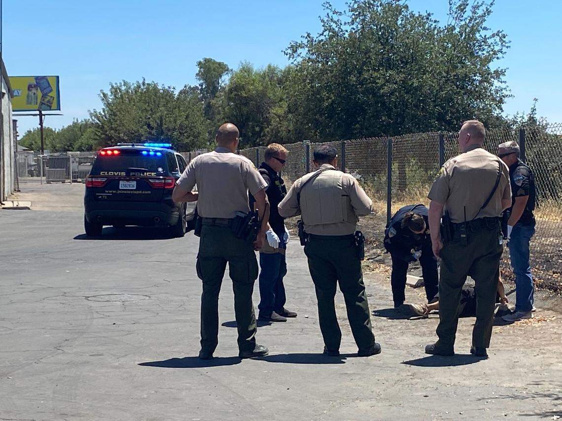 A man suspected of fleeing officers at the jail in downtown Fresno, California, on Thursday, July 21, 2022, is taken into custody on Church Avenue.
