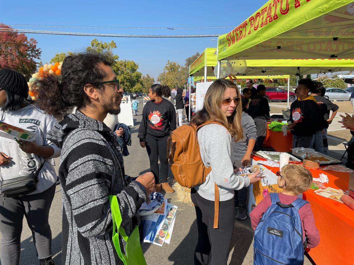 Festival attendees line up for sweet potato churros at the Sweet Potato Festival in Fresno, CA, on Saturday, Nov. 12, 20122.