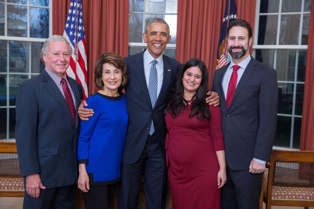 President Barack Obama with his deputy cabinet secretary, Michael Robertson, right, and Robertson’s family, pictured from left, parents John and Karyn Robertson, and wife Sahar Robertson, pose for a departure photo in the Oval Office on Jan. 3, 2017.