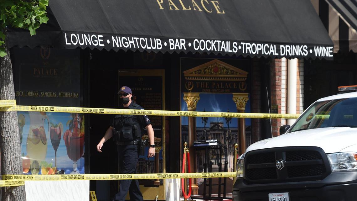 Clovis Police investigate a shooting at The Palace bar in Clovis, California on Saturday, May 22, 2021. Two men were shot to death and another was wounded.