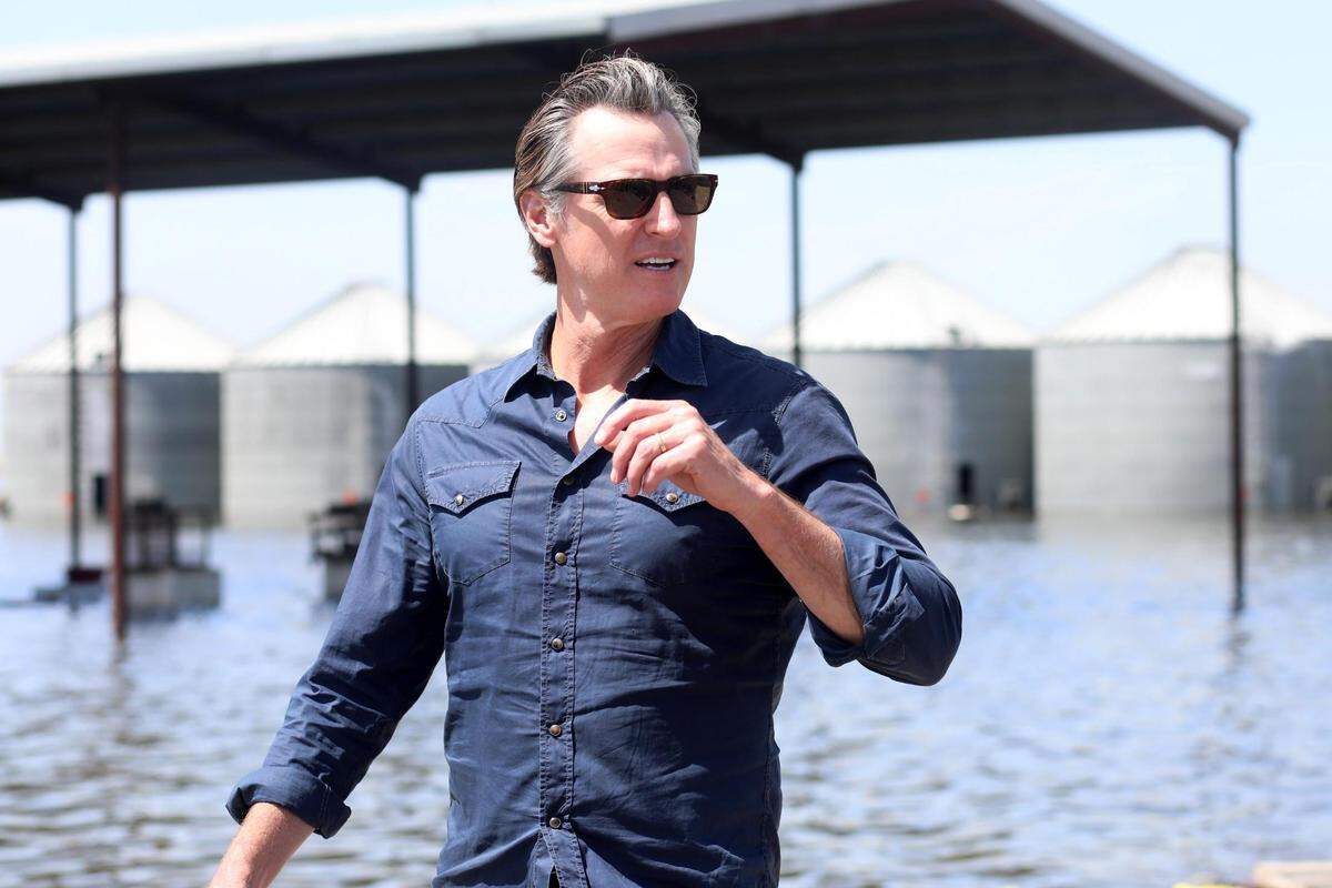 California Gov. Gavin Newsom arrives to speak to the media at Hansen Ranches on 6th Avenue Tuesday, April 25, 2023, south of Corcoran, CA.