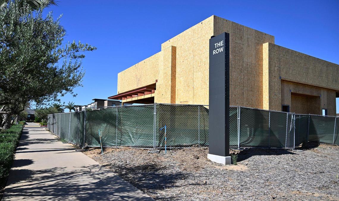 A building is being constructed along Shepherd Avenue at the south entrance to The Row, a new development consisting of housing, offices, restaurants and retail shops. Photographed Wednesday, July 12, 2023 in Fresno.