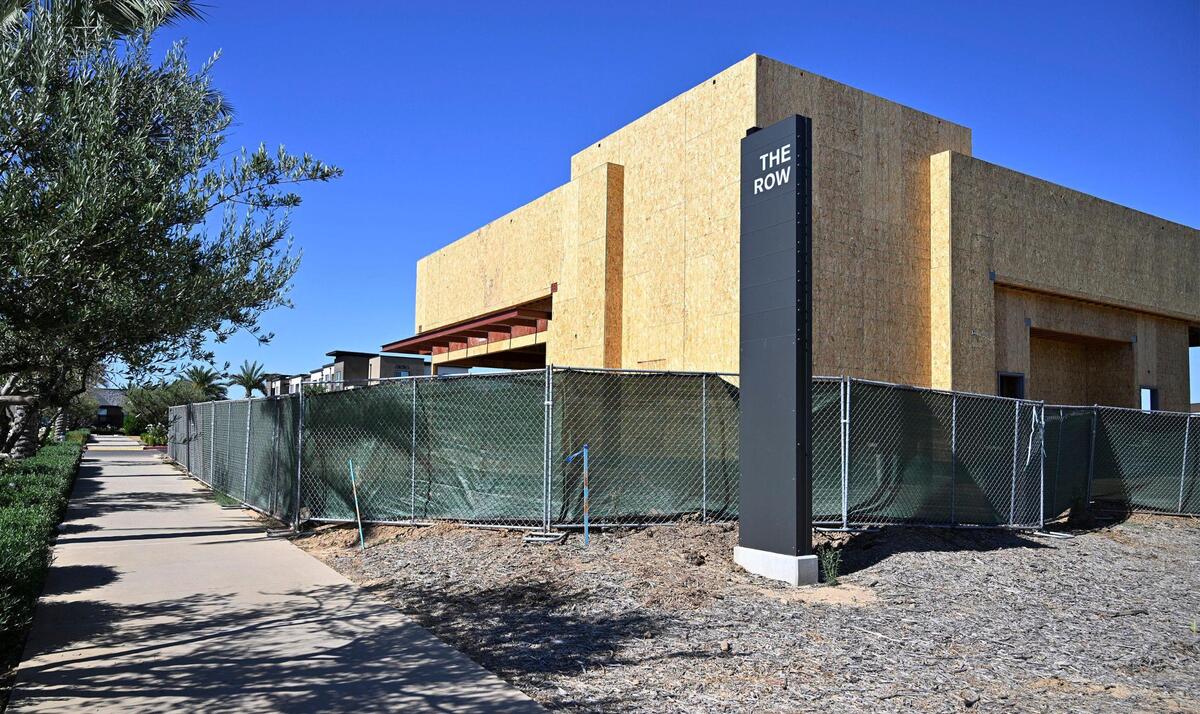 A building is being constructed along Shepherd Avenue at the south entrance to The Row, a new development consisting of housing, offices, restaurants and retail shops. Photographed Wednesday, July 12, 2023 in Fresno.