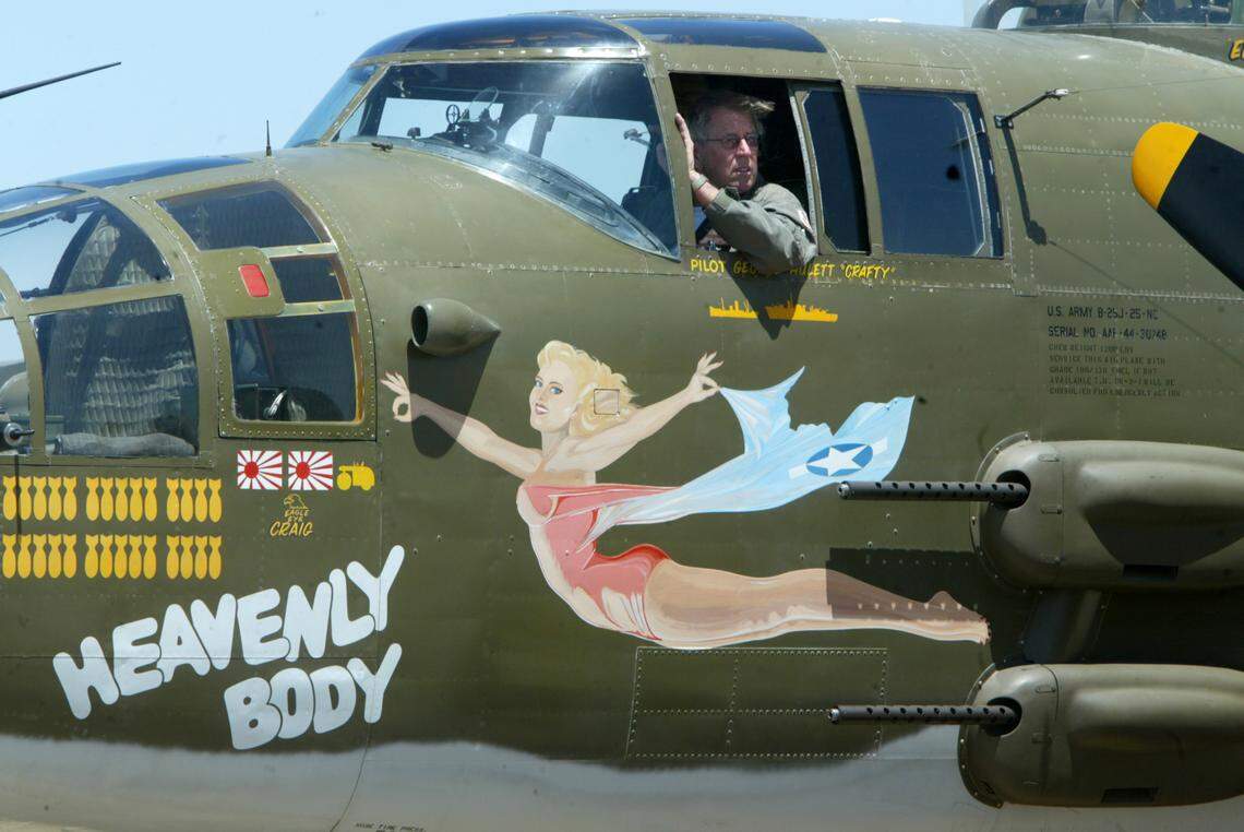 Crew member Chuck Enoch sits in the pilots seat while a B-25 Mitchell bomber that was part of a fly-in at Eagle Field in Dos Palos is towed into position on the tarmac after landing in June 2007.