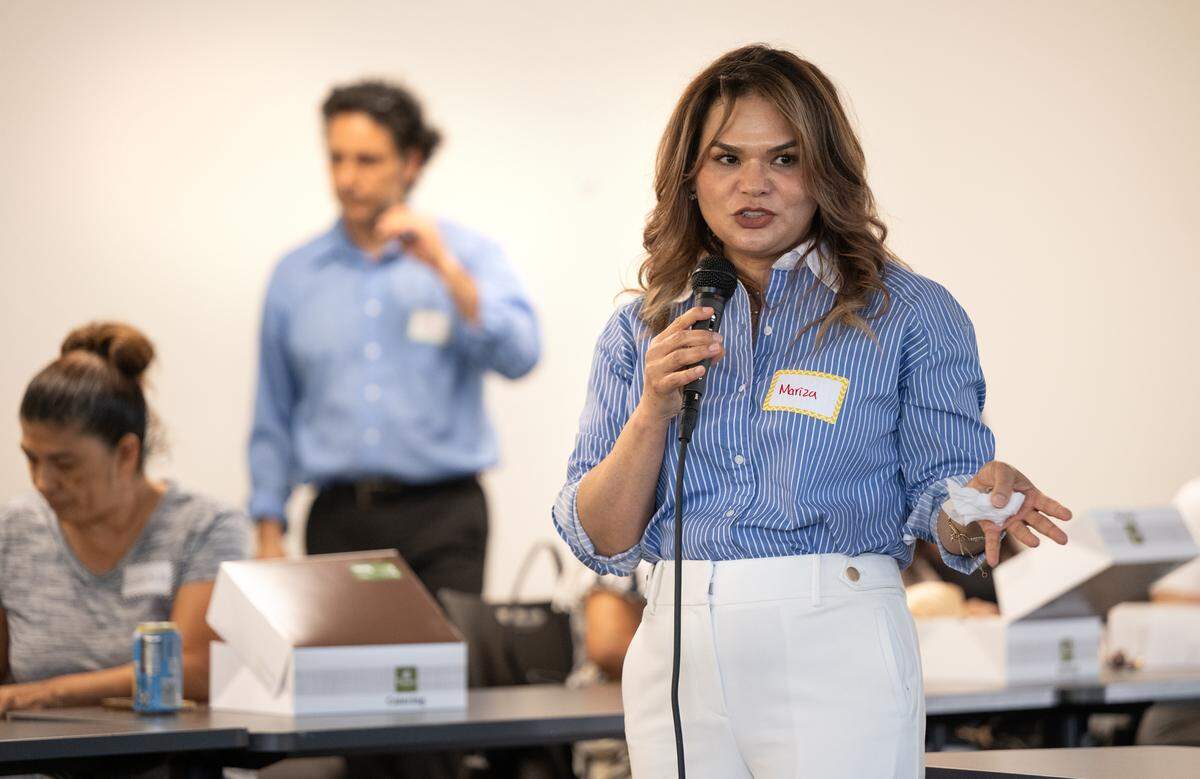 Escuchen Mi Voz Executive Director Mariza Ochoa makes introductions during a parent emotional support meeting in Modesto, Calif., Friday, Aug. 9, 2024. The nonprofit helps Spanish-speaking parents navigate complicated bureaucratic systems to get services and care for their children with disabilities.