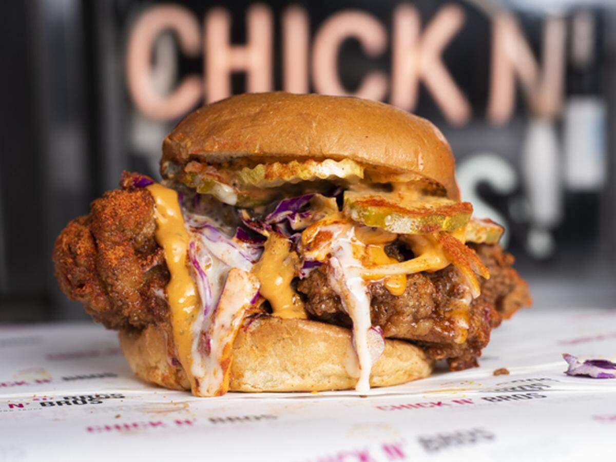 The Nashville Fire sandwich at CHICK N’ BROS comes with spicy adobo aioli “bro sauce,” sweet and tangy “chick sauce,” onion, pickle, purple cabbage, cayenne pepper, paprika and honey.