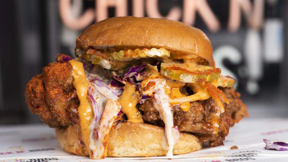 The Nashville Fire sandwich comes with spicy adobo aioli “bro sauce,” sweet and tangy “chick sauce,” onion, pickle, purple cabbage, cayenne pepper, paprika and honey.