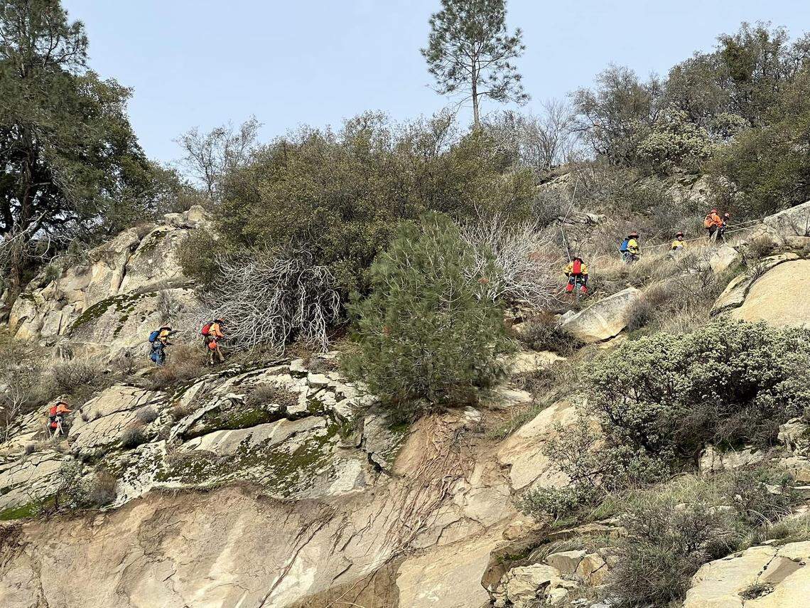 A Caltrans scaling team assesses the side of the mountain where a recent rockslide has led to the closure of Highway 168 in eastern Fresno County.