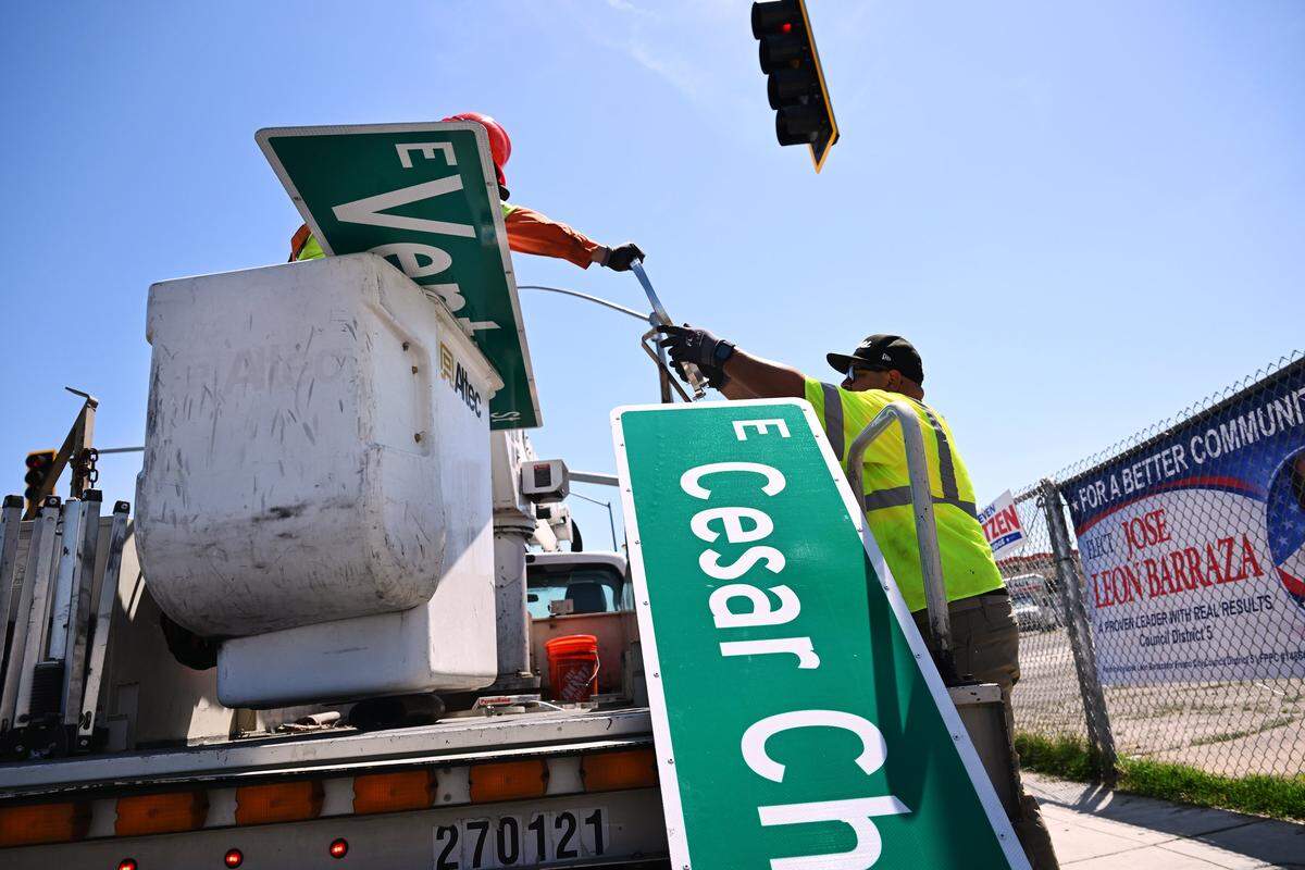 City of Fresno crews begin taking down the Cesar Chavez street signs, replacing with Ventura Street signs Friday morning, May 1, 2026 in Fresno.