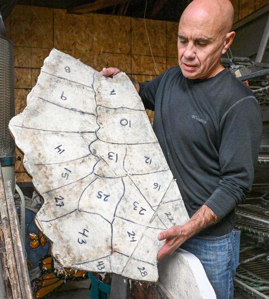 David Roberts shows a base piece for part of a wing of a great blue heron ceramic mural that he and a class of University High School students created in 2022. He has been trying to find someone willing to invest in having the piece installed along the Lewis S. Eaton Trail in north Fresno to no avail.