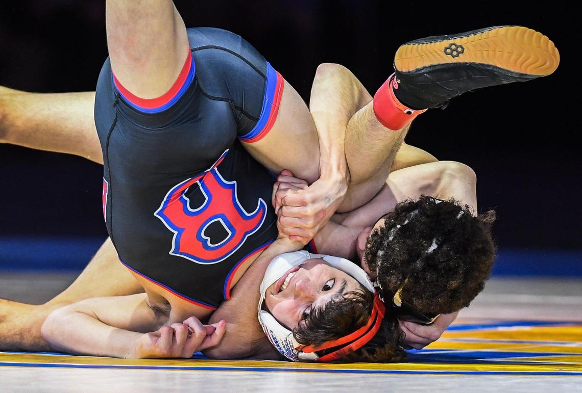 Buchanan’s Rocklin Zinkin, bottom, wrestles Clarence Moore in the boys 106-pound CIF State Wrestling Championship match at Mechanics Bank Arena in Bakersfield on Saturday, Feb. 25, 2023. Zinkin lost the bout and finished second overall.