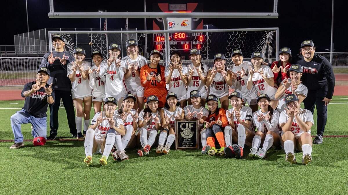 The Kerman High girls soccer team poses for a photo after winning the Central Section Division III championship on Tuesday, Feb. 24, 2026.