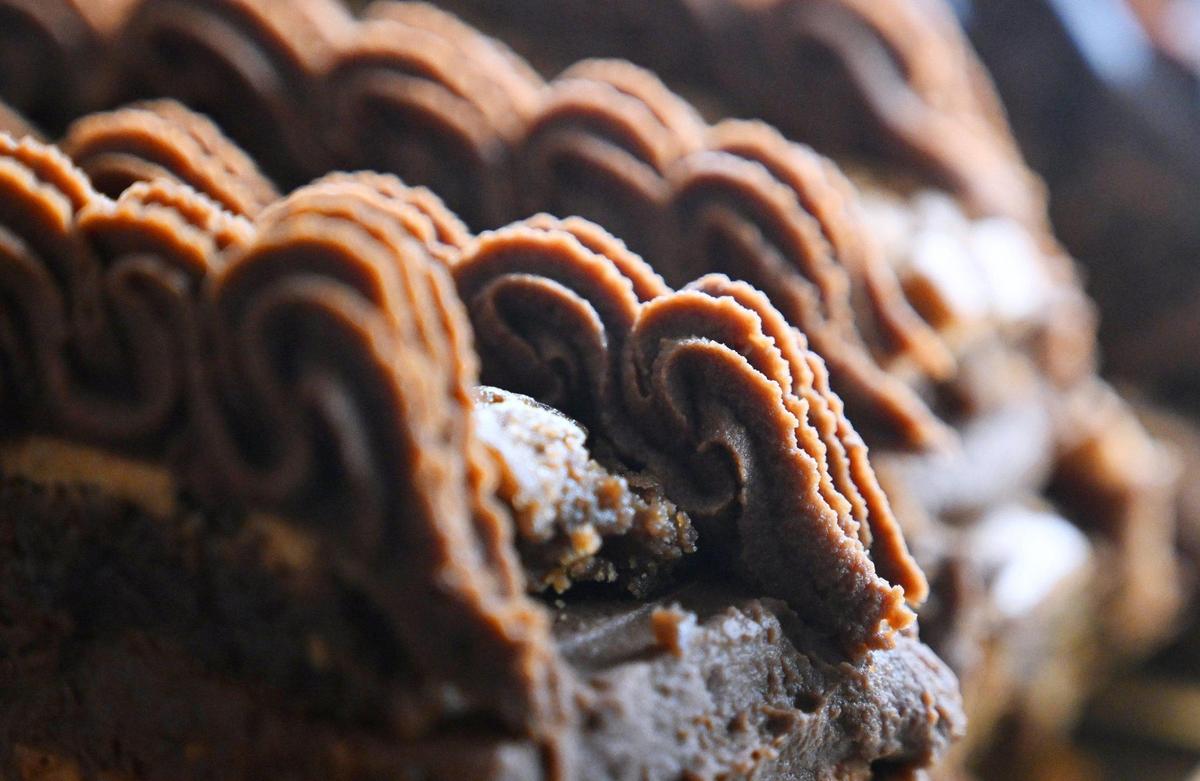 Slices of flourless chocolate cake sit in the case at Rustika Cafe & Bakery, a new bakery and cafe at Herndon and Willow avenues.