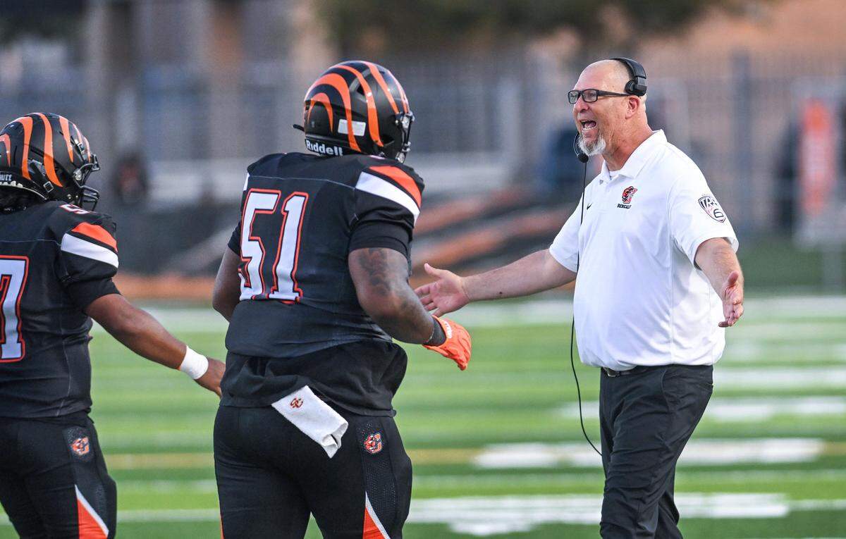 Central East head coach Kyle Biggs congratulates players after scoring against inglewood during their game at Koligian Stadium on Friday, Aug. 22, 2025.