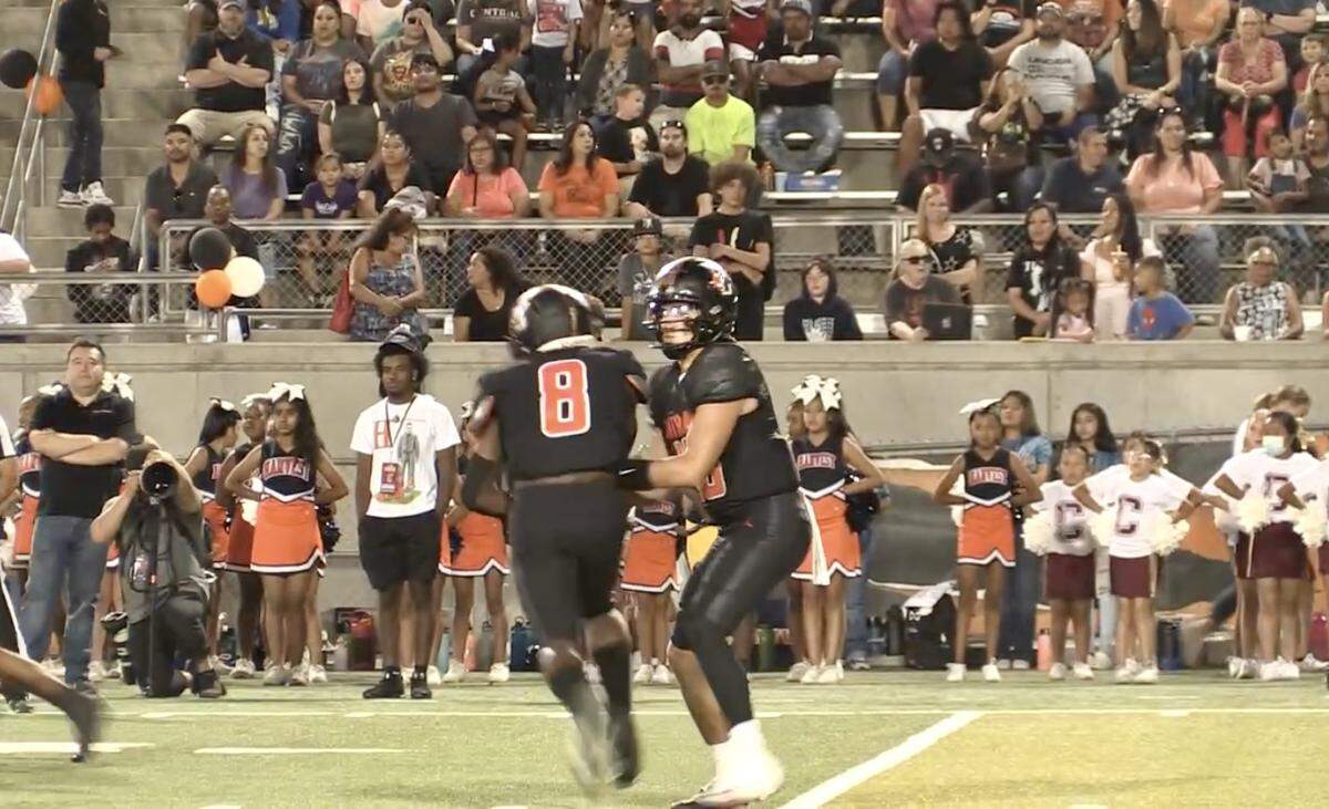 Central quarterback Dayton Tafoya hands off to running back Michael James against Liberty-Bakersfield on Friday, Sept. 16, 2022.