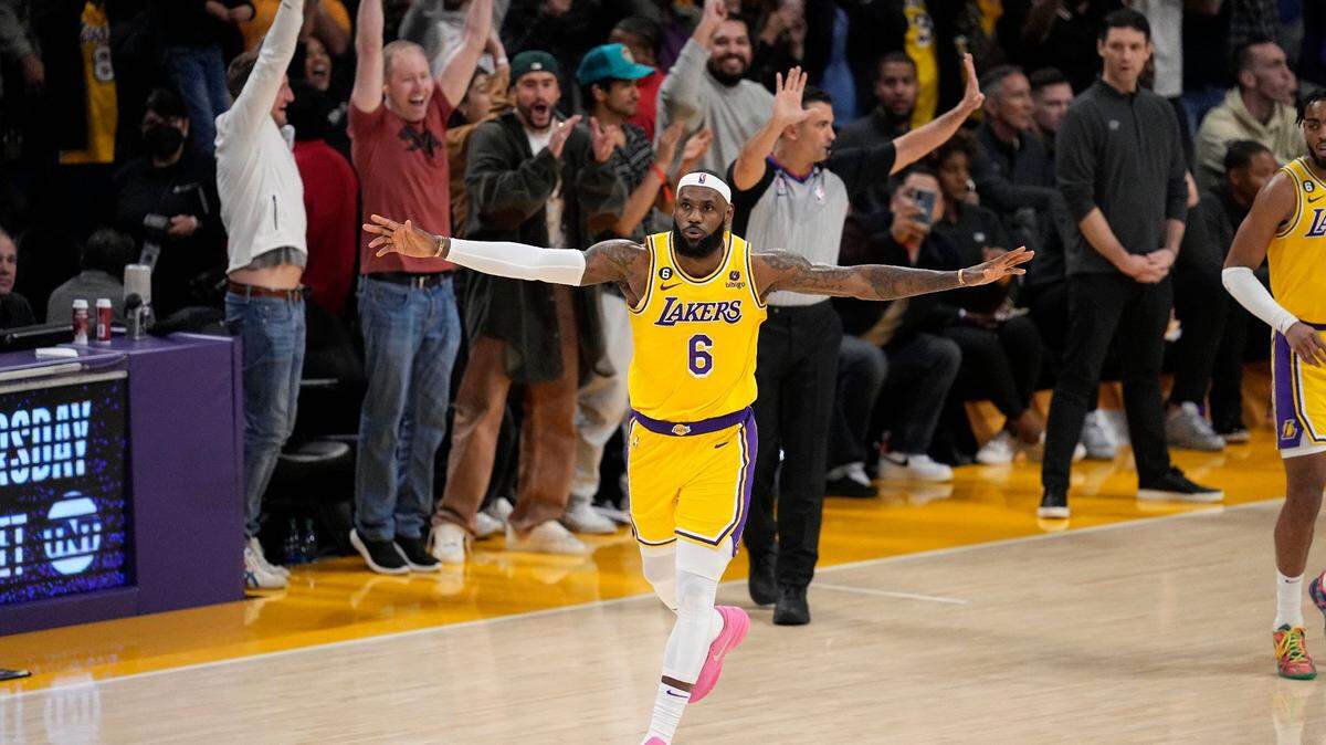 Los Angeles Lakers forward LeBron James celebrates after scoring to pass Kareem Abdul-Jabbar to become the NBA’s all-time leading scorer during the second half of an NBA game against the Oklahoma City Thunder Tuesday, Feb. 7, 2023, in Los Angeles.