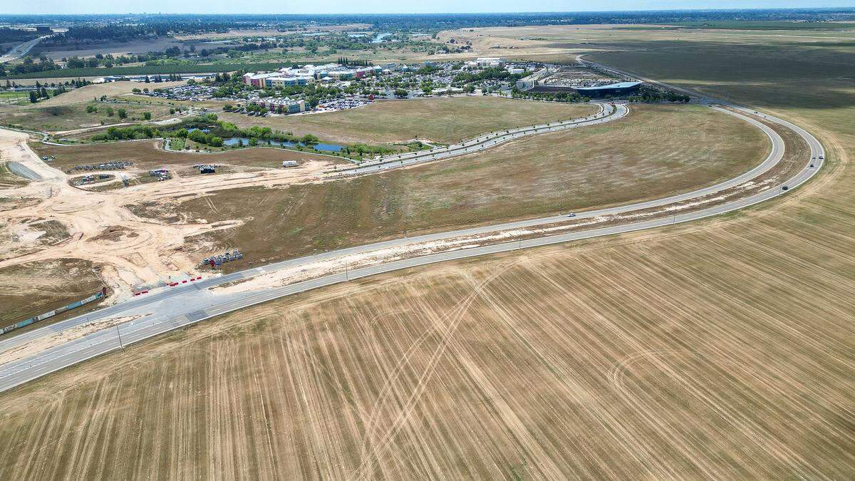 Valley Children's Hospital appears in the background with part of the 277 additional acres of land it purchased in the foreground just below Children's Boulevard in Madera County on Monday, April 27, 2026.