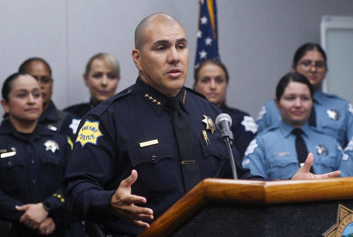 Fresno Chief of Police Paco Balderrama, center, announces a commitment to the 30x30 Pledge, a focus on improving the representation of women in the police force at a news conference Friday, March 25, 2022 in Fresno. The national initiative’s focus is to increase the numbers to 30 percent of women in new police recruits by 2030.