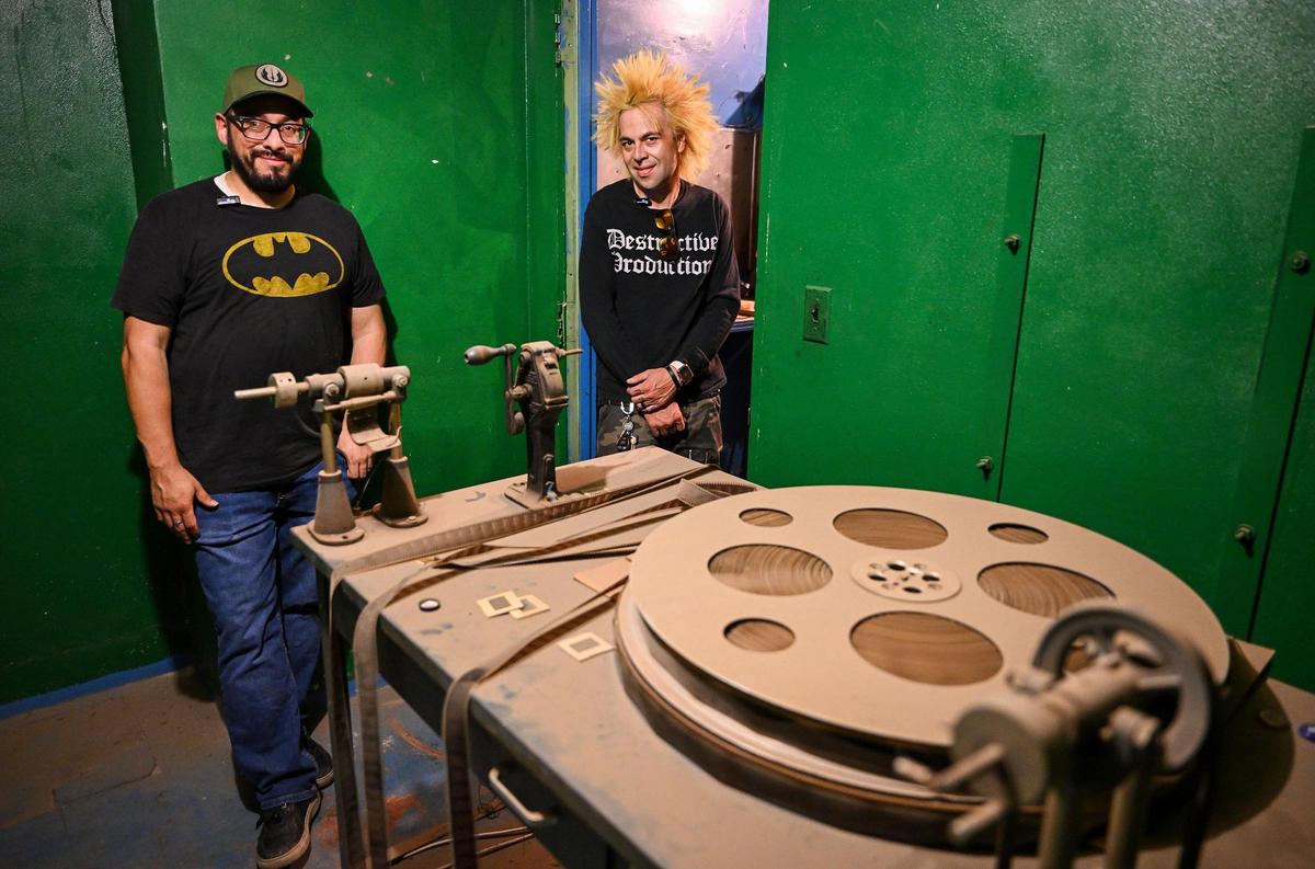 Gabriel Rodriguez, left, a partner with the Historic Crest Theatre, and local musician and promoter Franco Villanueva, stand in the production room of the Crest Theatre in downtown Fresno. Owners are currently raising money through GoFundMe to replace the air conditioning unit that failed during the pandemic.