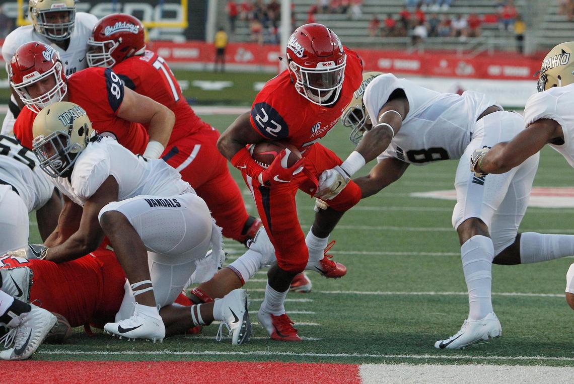 Fresno State running back Jordan Mims (22) blasts into the end zone, one of his three touchdowns in a season-opening rout of Idaho a year ago. The Bulldogs this spring are looking for replacements for four starters on the offensive line, who created those holes.