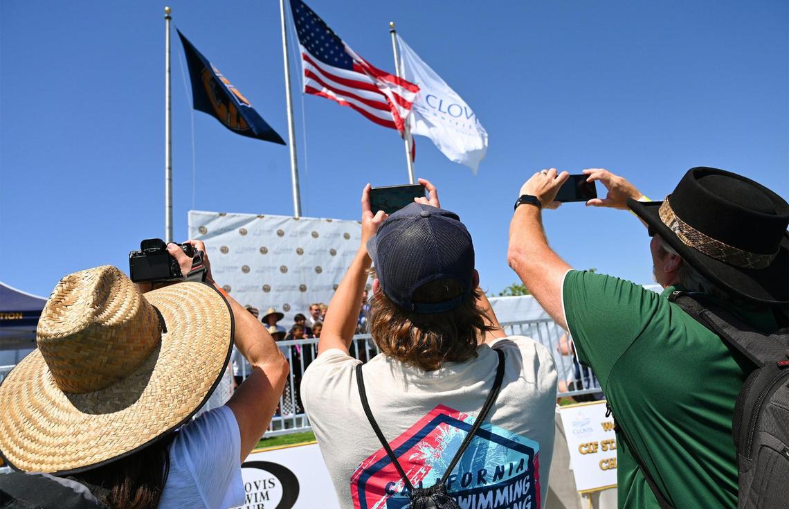 Supporters photograph winners of a team relay event at the CIF swimming and diving state championships on Saturday, May 13, 2023 in Fresno.