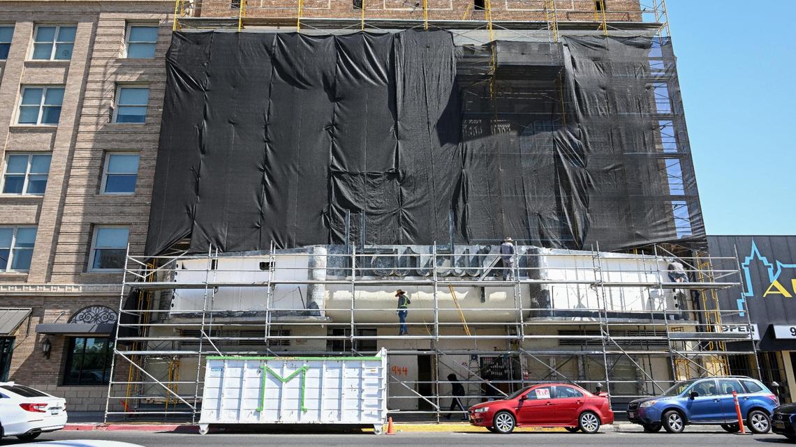 Scaffolding covers the front of the Hardy’s Theater building in downtown Fresno where work continues on the remodeling of the historic theater’s facade and sign on Tuesday, Sept. 19, 2023.