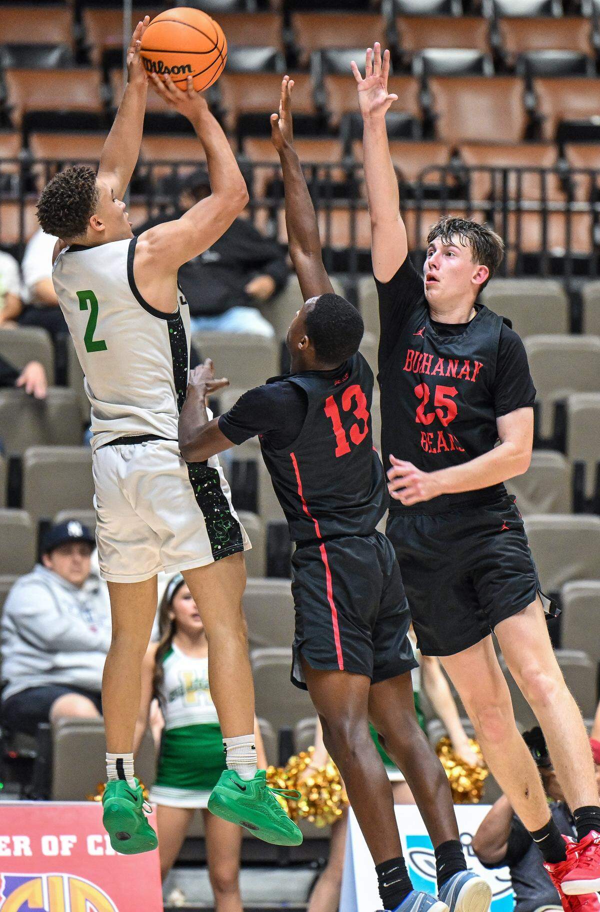 Buchanan's Josiah Perry, center, and Brayden Harris try to block a shot by St. Joseph's Malcolm Price during their Central Section Division 1 boys basketball championship game at Selland Arena on Saturday, Feb. 28, 2026.