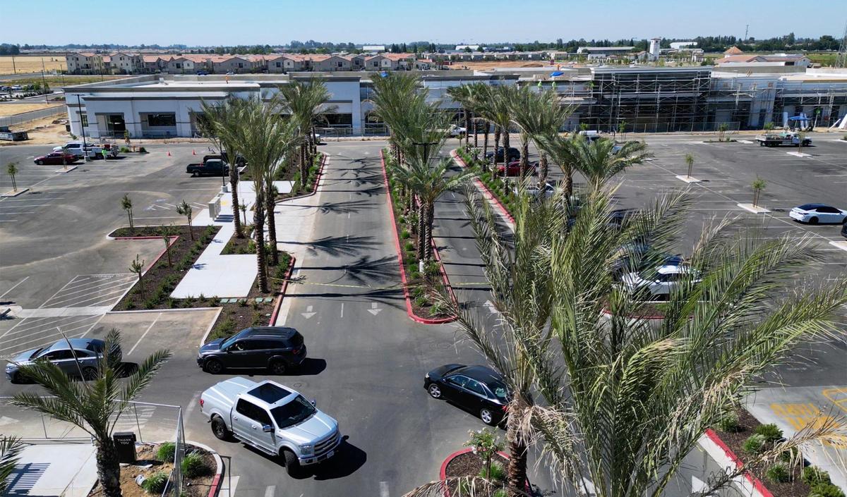 Traffic enters Loma Vista Marketplace shopping center, bottom left, located at Shaw and Leonard avenues, while construction continues, background, Thursday, July 10, 2025 in Clovis.