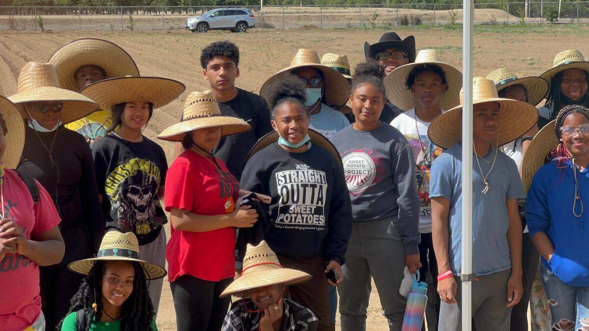 Participants of the Sweet Potato Project during the 2021 harvest.