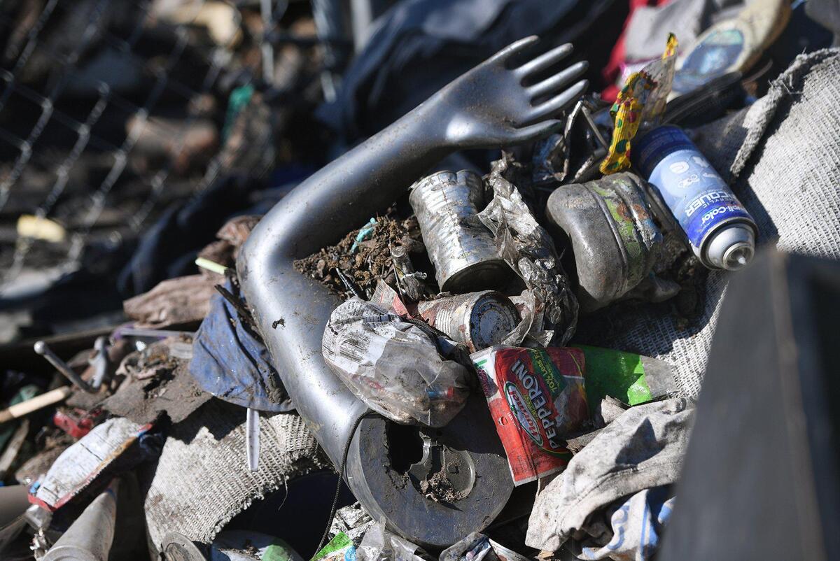 A mannequin’s arm is seen amid burned wreckage after two lots burned at the Trail’s End Mobile Home Park, leaving one dead Thursday April 29, 2021. Photographed Tuesday May 4, 2021 in Fresno.
