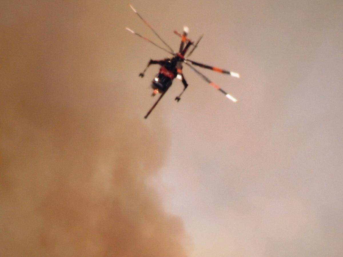 Firefighters were using helicopters, as well as fixed wing planes to fight the fire on the ridge close to Cascadel Woods.