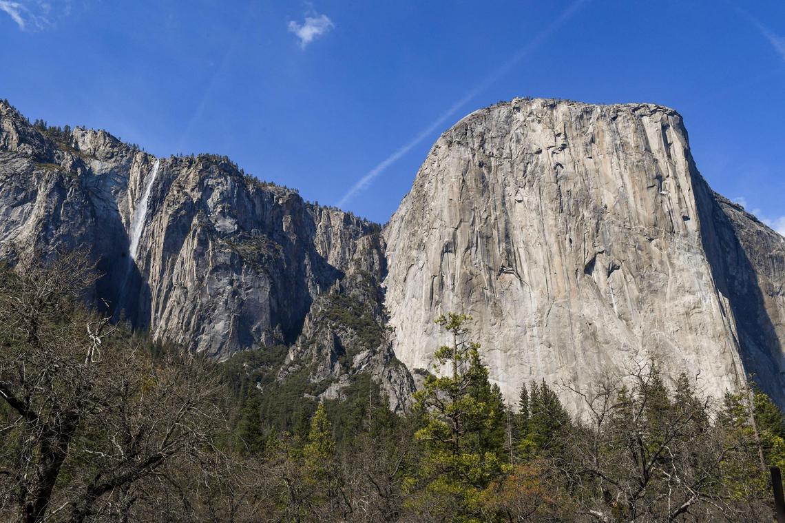 El Capitan comes into view on the western edge of Yosemite Valley as springtime runoff drops over Ribbon Fall to the left in Yosemite National Park on Friday, April 23, 2021.