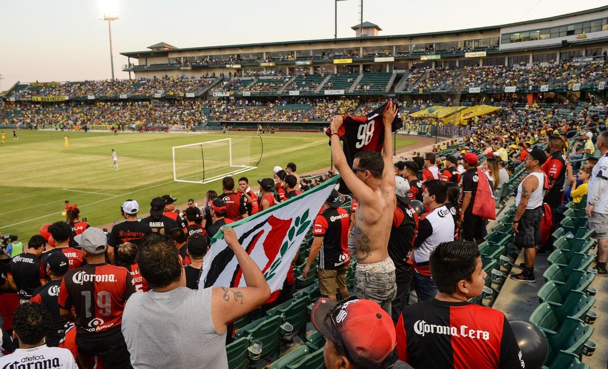 Fans of Los Zorros of Club Atlas cheer on their team in the stands at Chukchansi Park during the Liga MX exhibition match between Club Atlas and Club America in downtown Fresno on Wednesday, July 11, 2018.