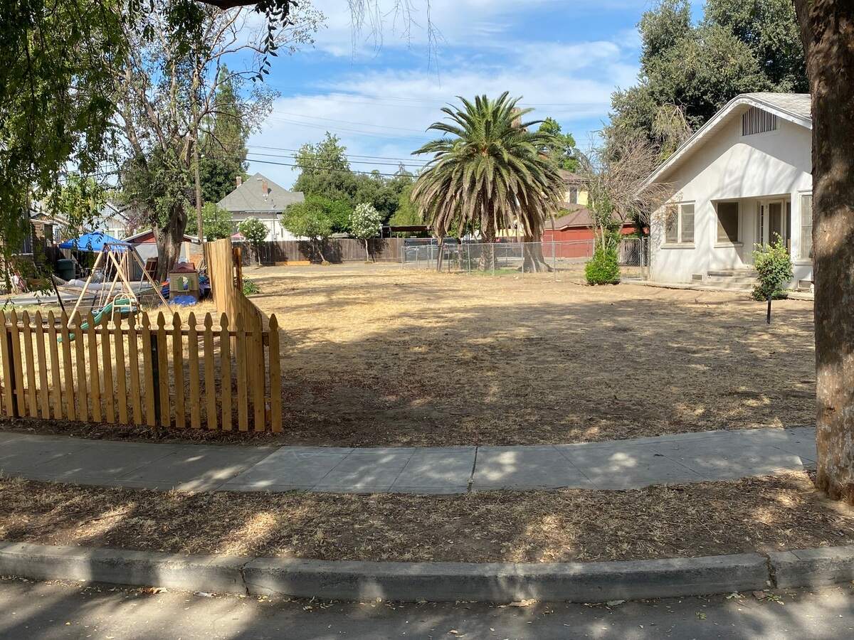 An empty lot sits Monday, Sept. 11, 2023, where the home burned and 7-year-old Isaac Villegas died at 423 N. College Ave. in Fresno.