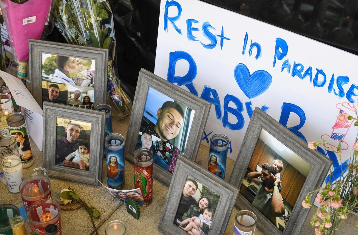 A memorial for 23-year-old Alex Solorio of Stratford, who was found dead inside Colima’s Fade Shop at Blackstone and Herndon avenues in Fresno last Sunday, sits outside the barbershop on Wednesday, June 2, 2021.