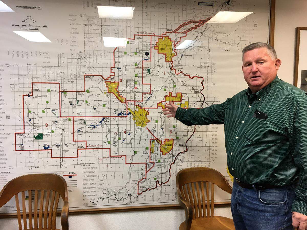 Phil Desatoff, general manager of Consolidated Irrigation District, which has filed a petition with the State Water Resources Control Board to keep Kings River flood water in Kings, Fresno and Tulare counties, points to recharge projects planned or underway on a map in his Selma office in October.